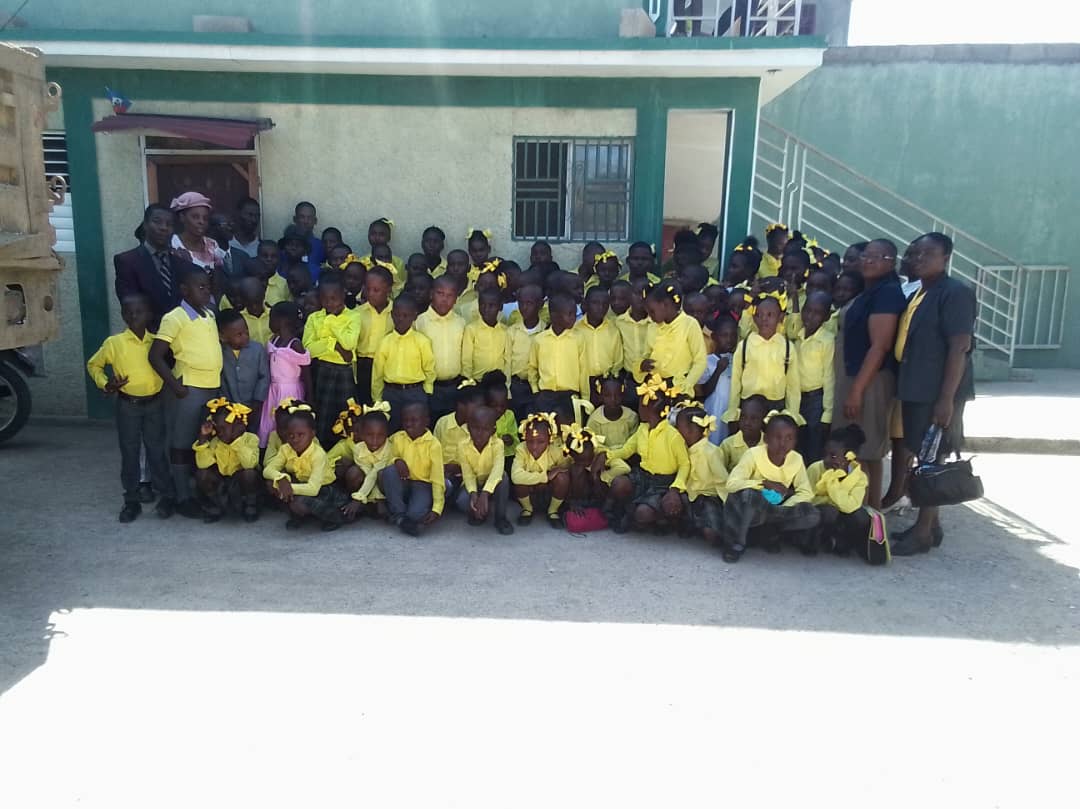Volunteers with children at La Paix Foundation campus